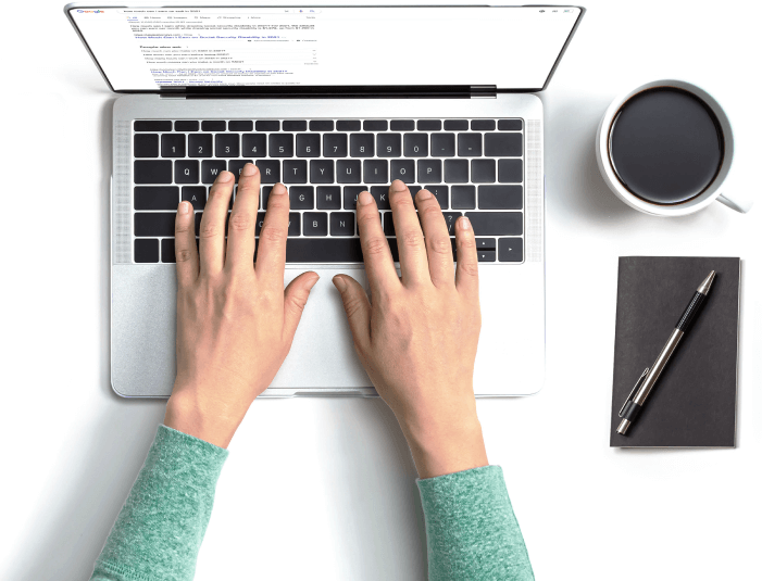 Hands on a laptop