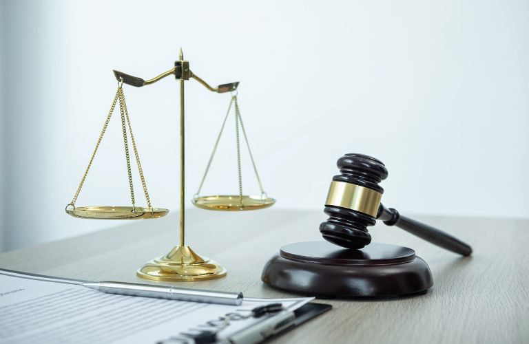 Gavel, Scales of Justice and Legal Documents on a Desk