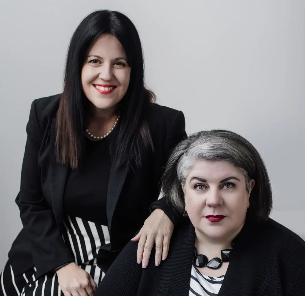 Two women, Tarah Tosh and Kirstie Colls, standing side by side
