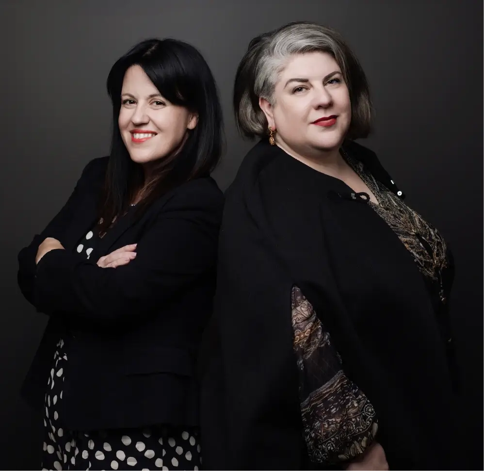 Two women, Tarah Tosh and Kirstie Colls, standing side by side