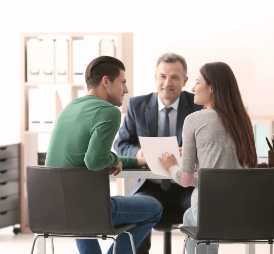 Three people meeting at a family law consultation.