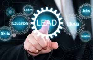 Businessperson in suit pointing at glowing gear icon labeled "LEAD" surrounded by related terms.
